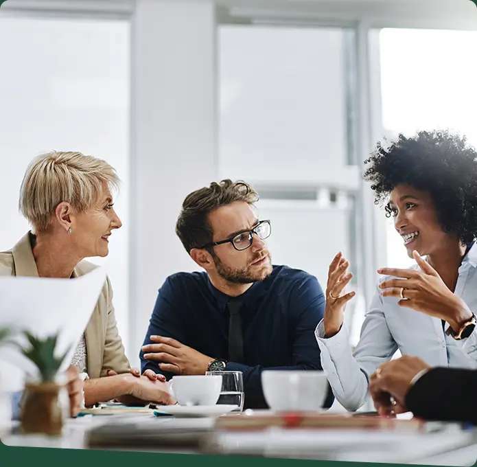 Three people are having a meeting.